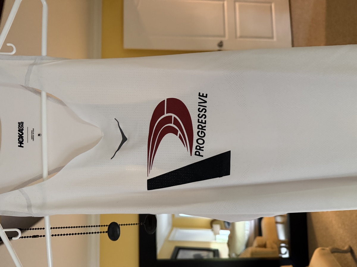 Progressive Training Team white racing singlet — front view with HOKA and Progressive logo