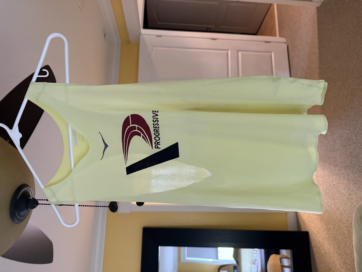 Progressive Training Team neon yellow racing singlet — front view with Progressive logo